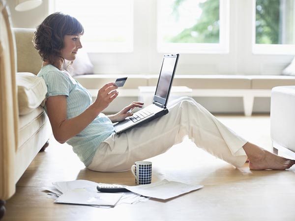Woman sitting on the floor working